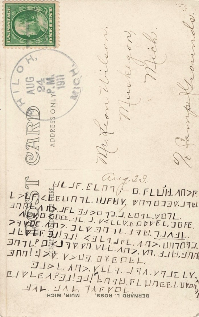 The back of the postcard - the encrypted message on the left and the address of the recipient on the right.