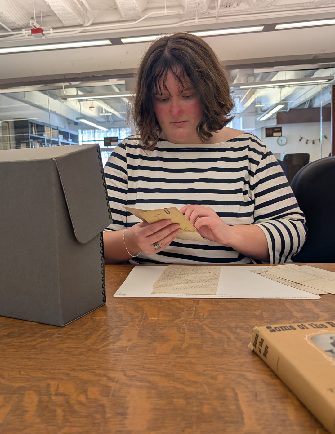 Diana Baxter with Manuscript materials.