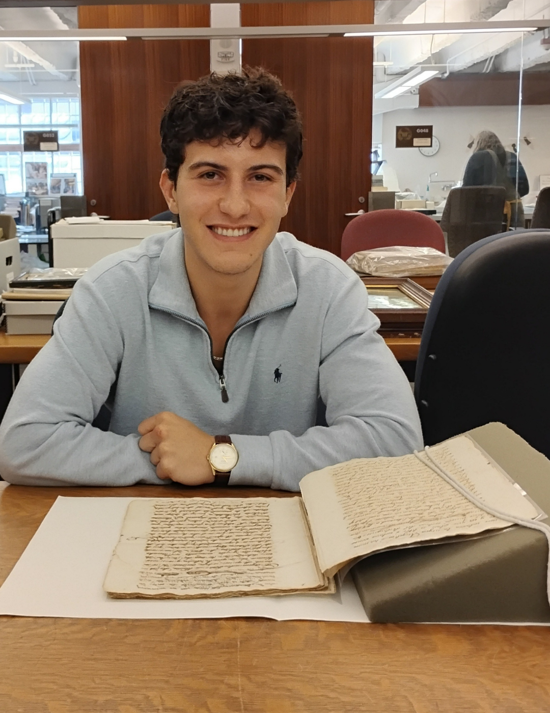 John Castellanos with manuscripts materials.