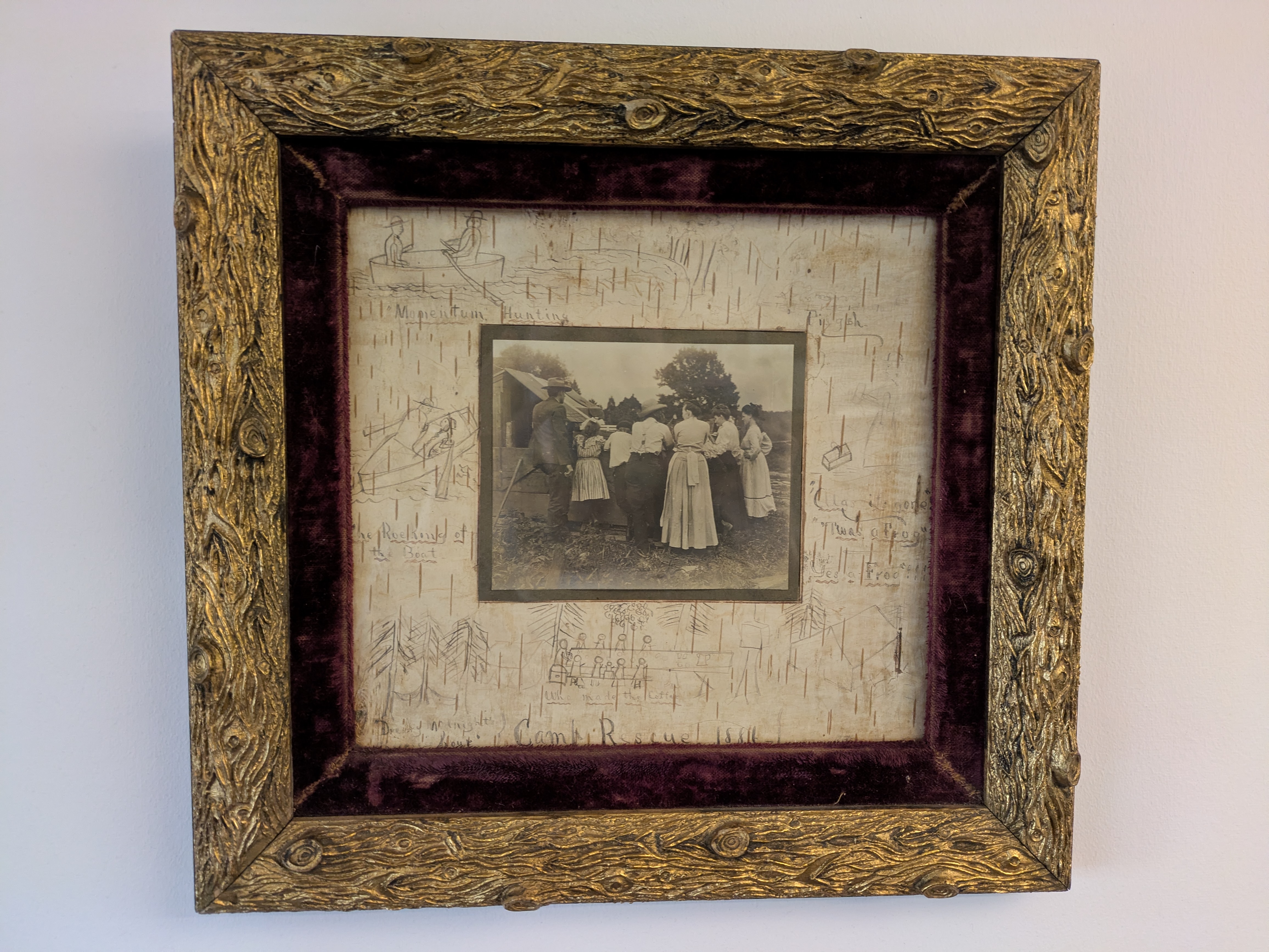 BirchBark Photograph of a family gathered at the fence of a farm pen, their backs are to the camera.
