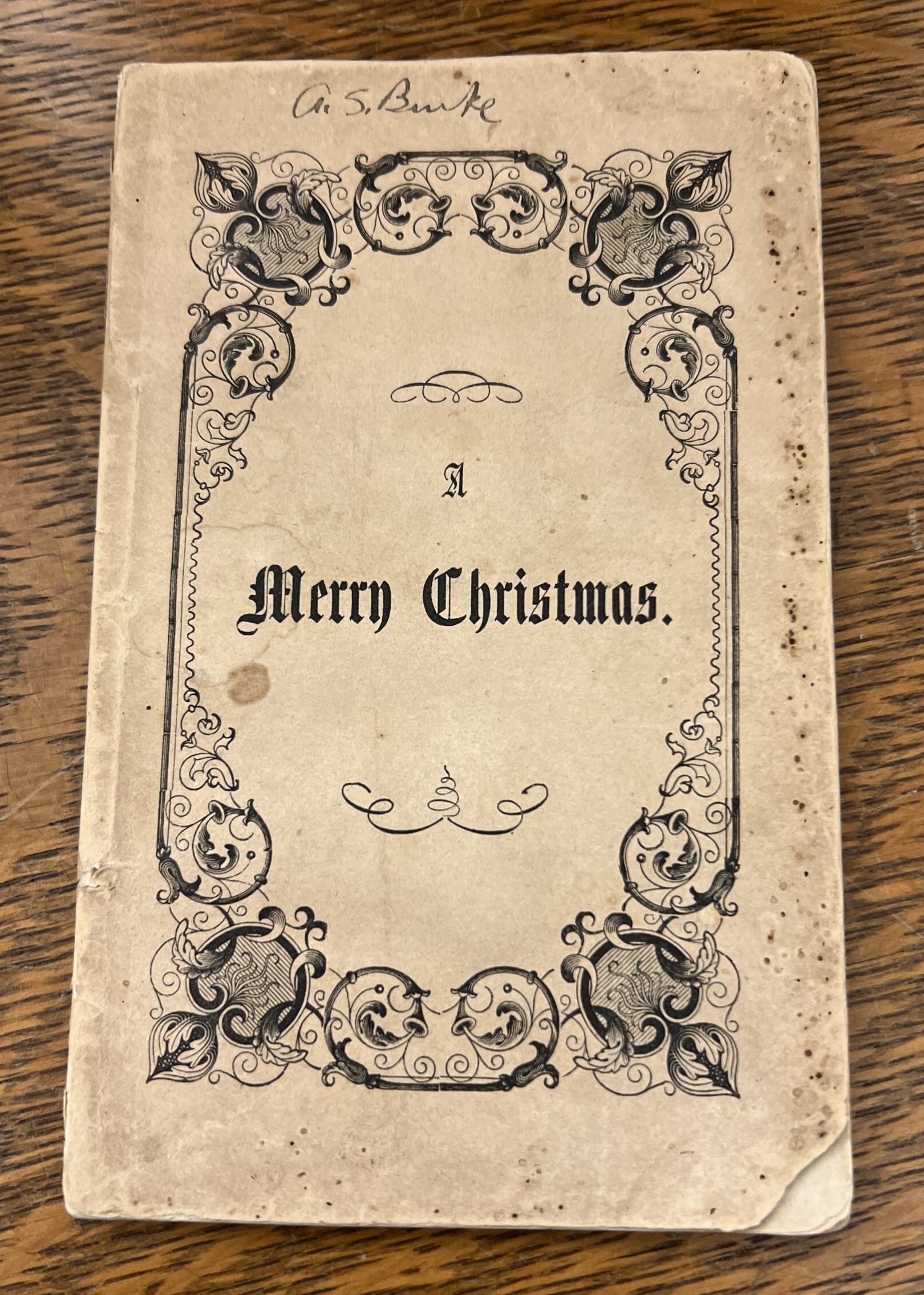 Cover Matilda Anne Mackarness' "A Merry Christmas" (1852) with ornate printed borders.