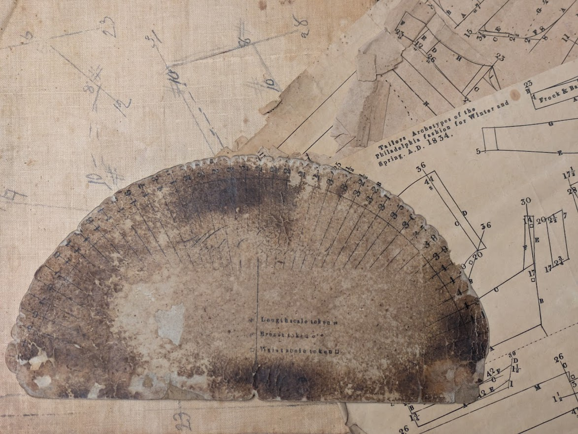 Steinruck Patterns and tailor's protractor from the William Steinruck account books and patterns collection.