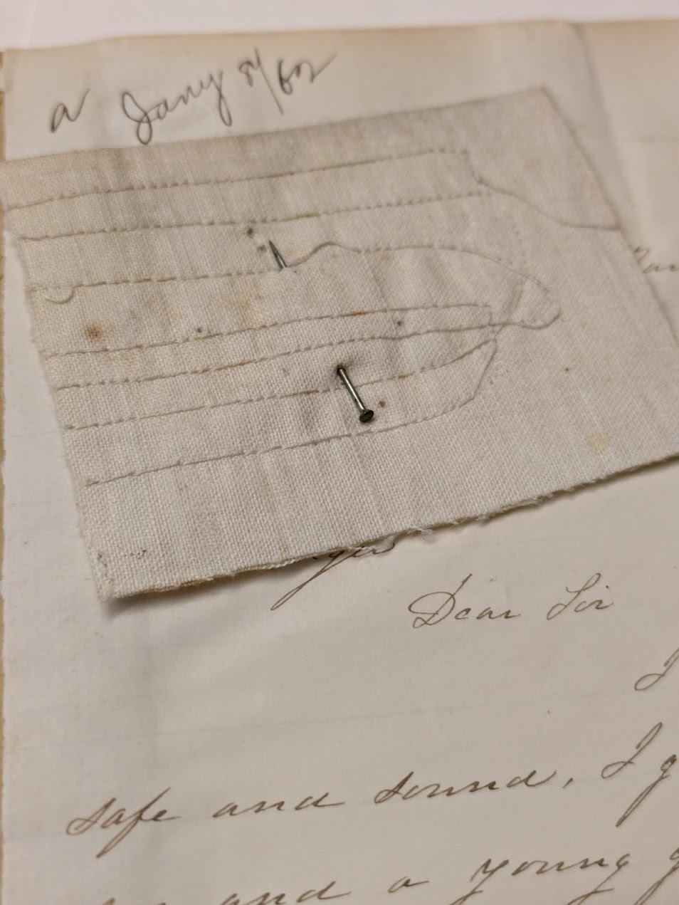 Singer Manufacturing Company 1862 manuscript letter with a sample of fabric showing sewing errors from a machine "skipping."