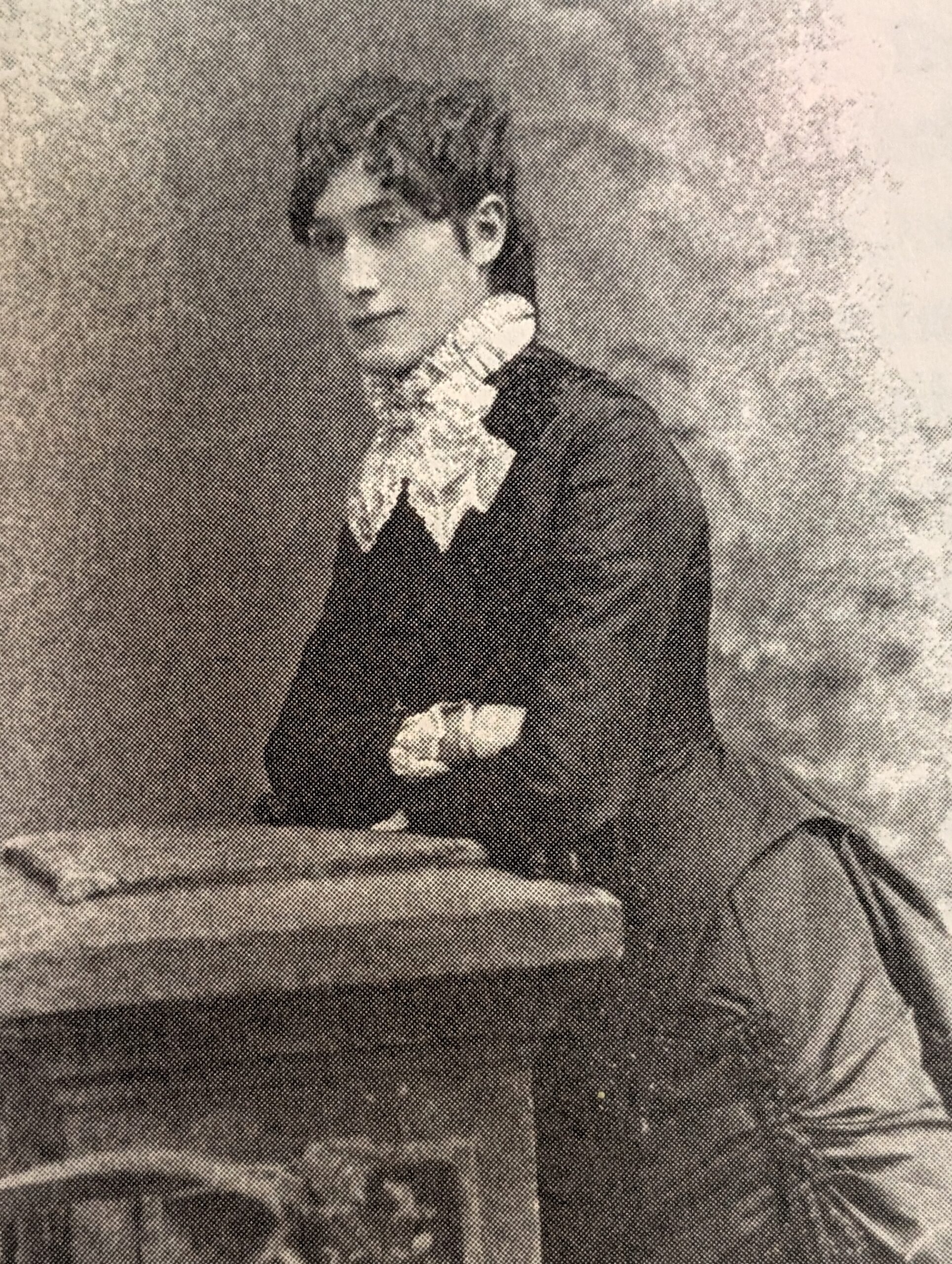 Susan Barnes Portrait of Susan Barnes leaning on a desk.
