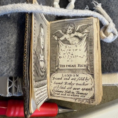 Jeremiah Rich Miniature book with an image of a cherub.