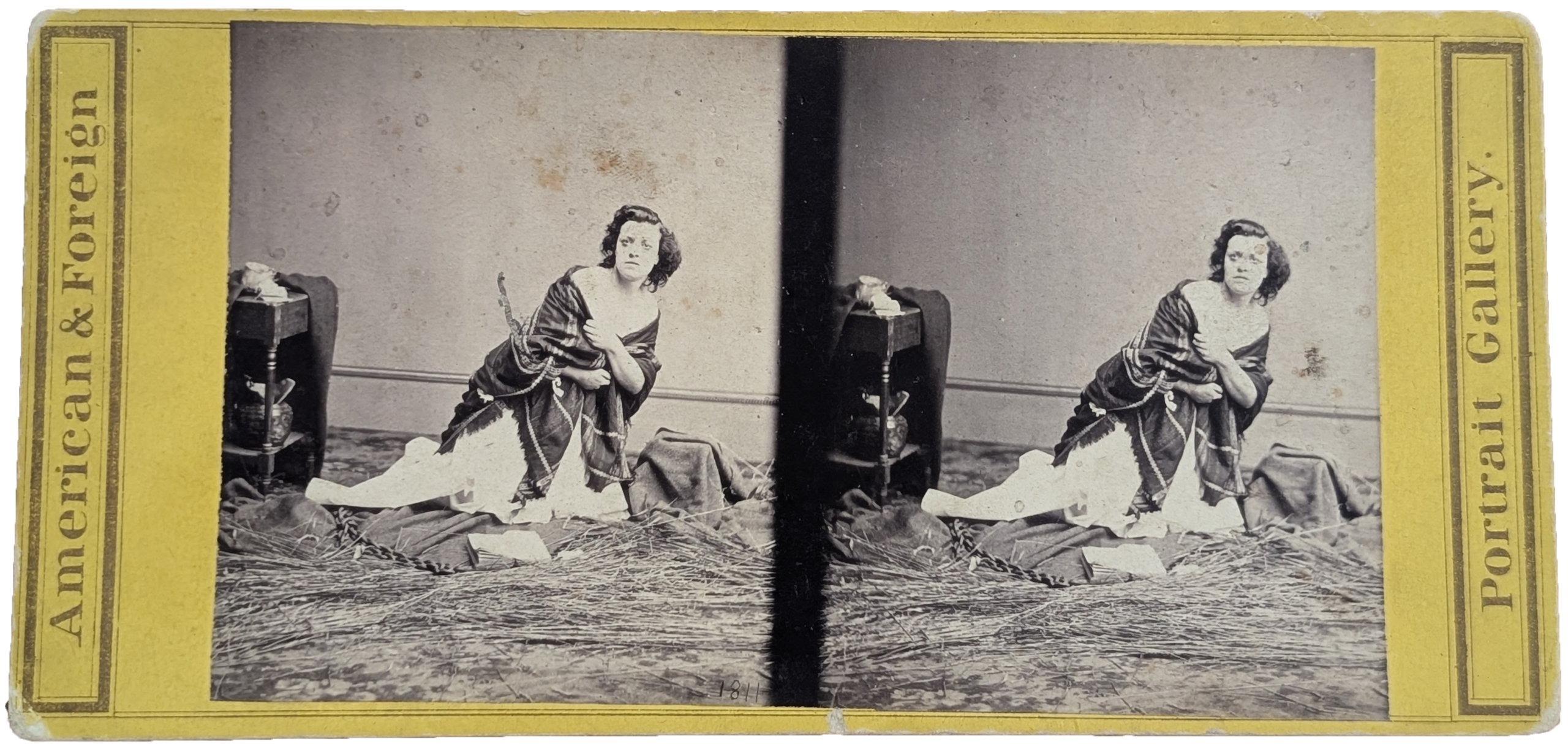 Pauline Cushman Stereoview Stereoview of a dramatic photo of Pauline Cushman, wrapped in a shawl and seated on the ground.