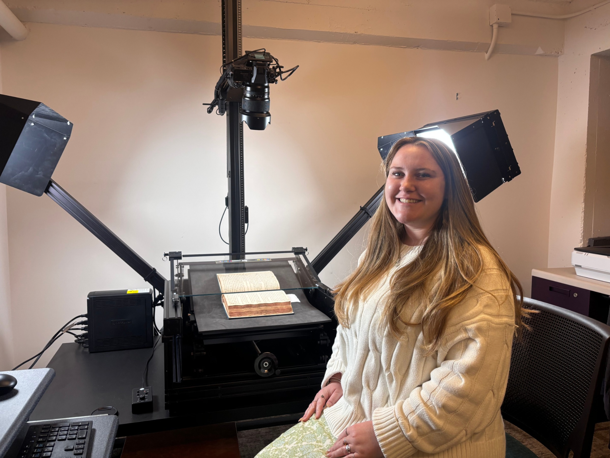 Digitization Specialist Carly Jensen pictured with the DT Atom Digitization Specialist Carly Jensen pictured with the DT Atom